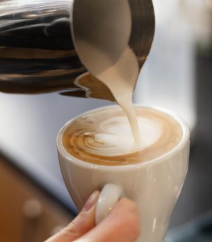 close-up-hand-holding-coffee-cup